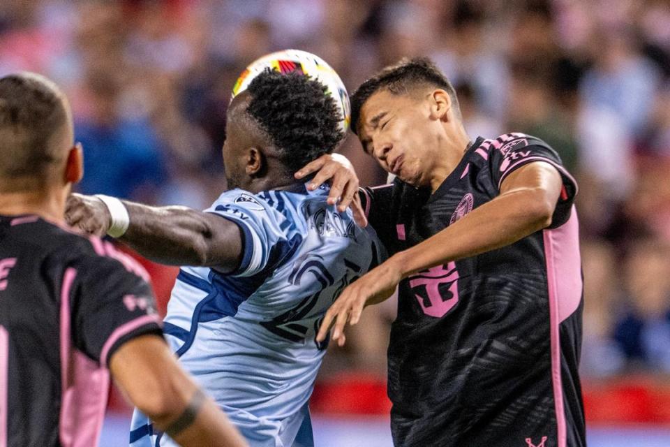Sporting Kansas City forward Willy Agada (23) attempts a header over Inter Miami midfielder Tomás Aviles (6) in the second half during an MLS game at GEHA Field at Arrowhead Stadium on Saturday, April 13, 2024, in Kansas City.