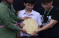 Student leaders install a plaque near the Grand Palace in Bangkok