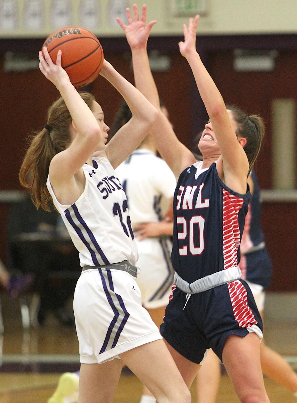 Bloomington South's Julia Lashley (32) looks to make a pass as Bedford North Lawrence's Emma Brown (20) defends in their girls' basketball game on Tuesday, Nov. 15, 2022.