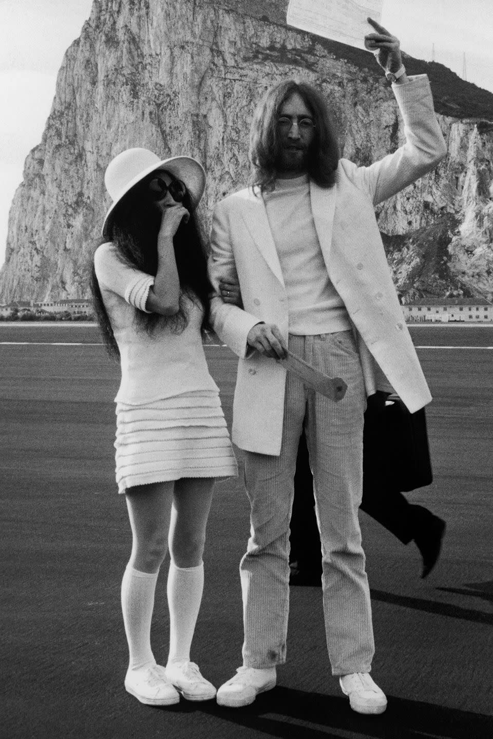 <p>Did you really think Yoko Ono would wear a conventional wedding dress to tie the knot with John Lennon? No way! The couple both wore white to the ceremony in Gibraltar. Yoko sported a miniskirt, top, floppy hat and knee socks.</p>