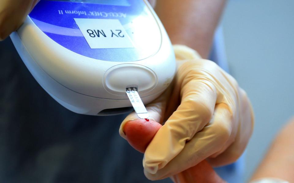 A patient's blood sugar level being tested - PA