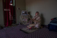 The 35-year-old transgender Kashmiri Shabnam Ganie prays at home in Srinagar, Indian controlled Kashmir, Friday, May 28, 2021. Shabnam is one of the few fortunate transgenders who own a home, where she lives with an adopted son. Life has not been easy for many of Kashmir's transgender people. Most are ostracized by families and bullied in society. They face domestic abuse and end up running away from families at an early age. Some lack housing, education and other basic resources. (AP Photo/ Dar Yasin)