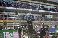 Mercedes driver Valtteri Bottas, of Finland, celebrates after coming in first in the qualifying run of the Formula One Mexico Grand Prix auto race at the Hermanos Rodriguez racetrack in Mexico City, Saturday, Nov. 6, 2021. (Francisco Guasco, Pool Photo via AP)