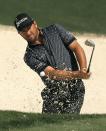 Graeme McDowell of Northern Ireland hits from a sand trap onto the tenth green during his practice round ahead of the 2015 Masters at the Augusta National Golf Course in Augusta, Georgia April 6, 2015. REUTERS/Brian Snyder