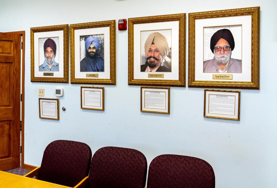 Memorial photos of the victims are placed in the library of the Sikh Temple of Wisconsin in Oak Creek.