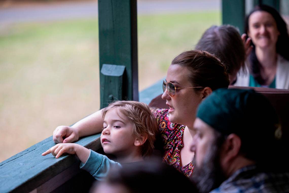 Lorelei Hopkins and her 4-year-old son Flynn ride the New Hope Valley Railway from Bonsal on April 12, 2024. The nonprofit railway celebrates its 40th year taking passengers on rides in southwest Wake County.