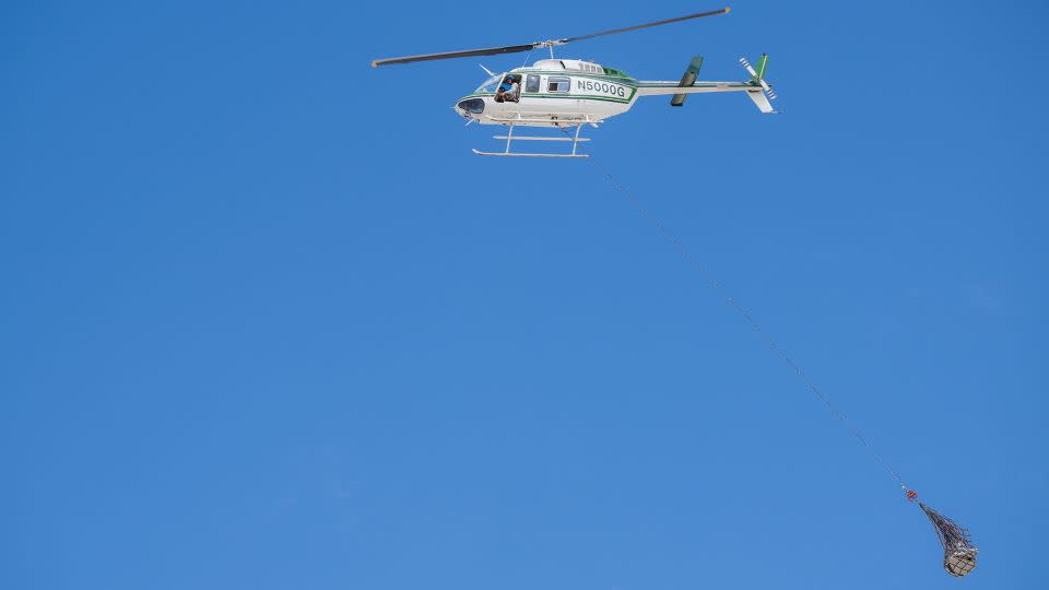 Recovery teams participate in helicopter training to retrieve the sample and transport it to a temporary cleanroom. - Keegan Barber/NASA