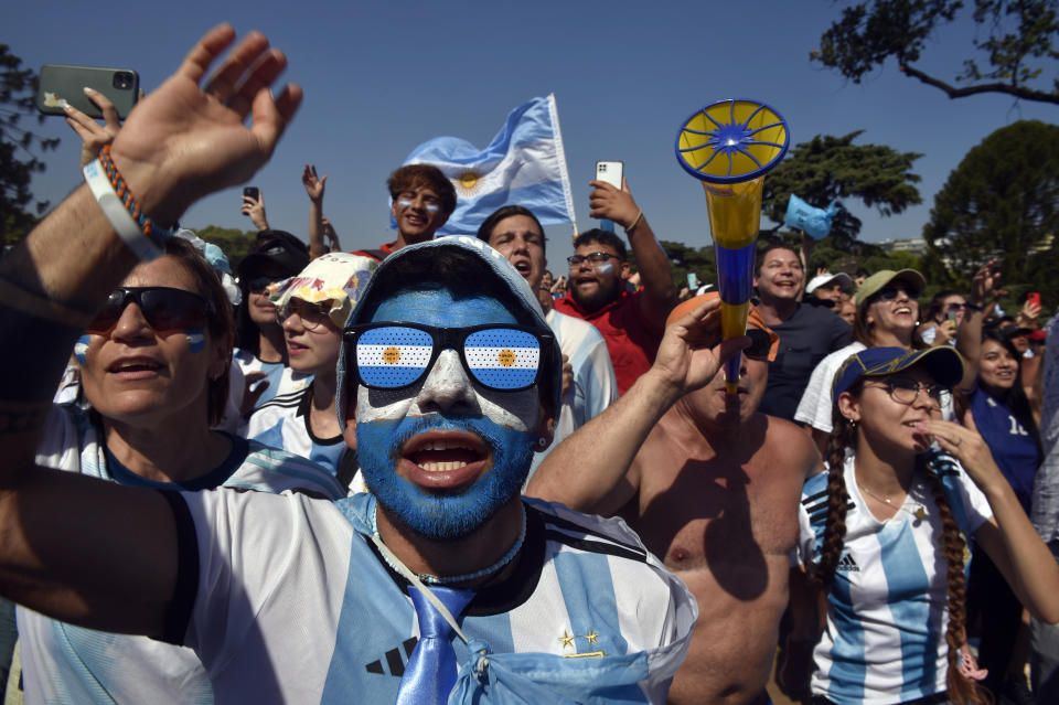 Argentina soccer fans watch their team's World Cup semifinal match against Croatia, hosted by Qatar, on a screen set up in the Palermo neighborhood of Buenos Aires, Argentina, Tuesday, Dec. 13, 2022. (AP Photo/Gustavo Garello)