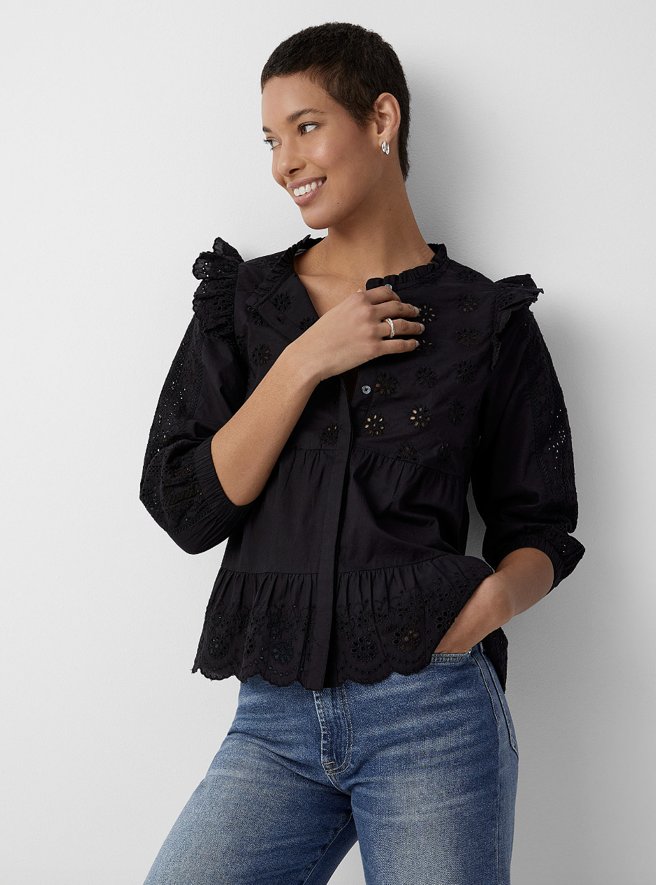 model in blue jeans and black top, Sona Broderie Anglaise Tiered Blouse (photo via Simons)