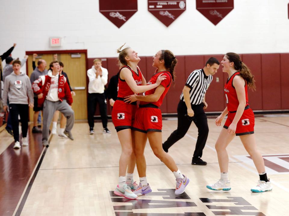 Sheridan's Jamisyn Stinson, left, Halle Warner and Payton Powell celebrate a 58-55 win against host John Glenn on Friday in New Concord. The Generals overcame a nine-point second-half deficit to stay unbeaten.