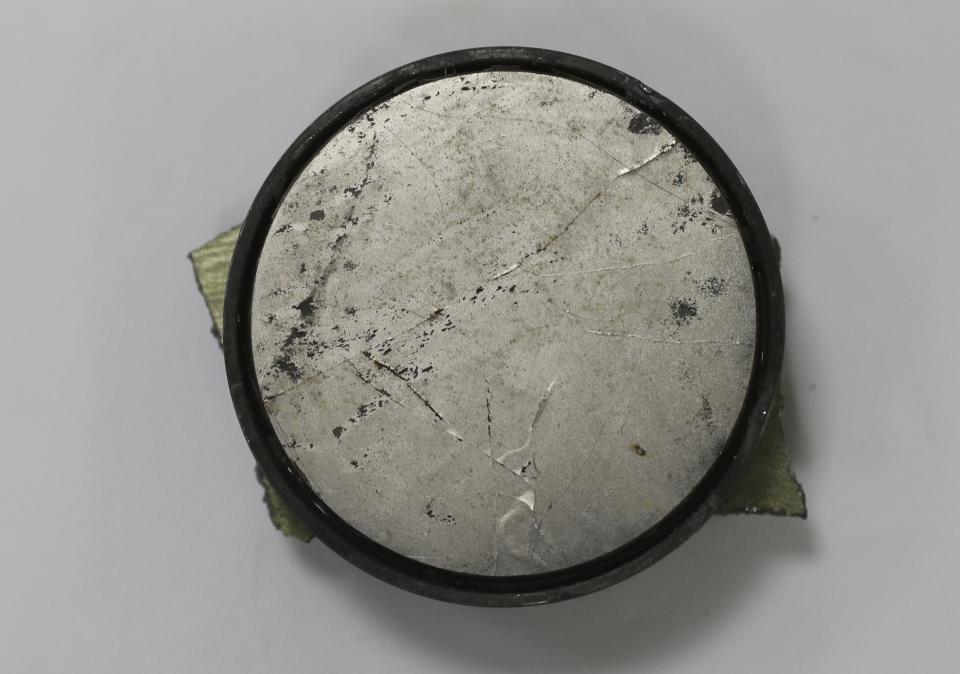 A magnet is shown as the U.S. Navy says came from a limpet mine that didn't explode on a Japanese-owned oil tanker at a 5th Fleet base, during a trip organized by the Navy for journalists, near Fujairah, United Arab Emirates, Wednesday, June 19, 2019. (AP Photo/Kamran Jebreili)