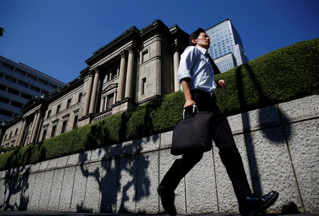 A man runs past the Bank of Japan (BOJ) building in Tokyo, Japan, July 29, 2016. REUTERS/Kim Kyung-Hoon/Files