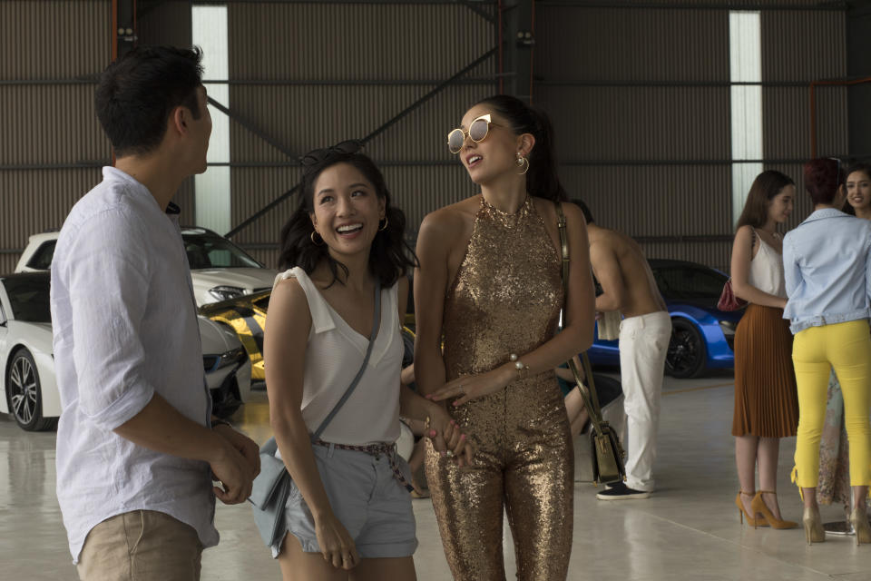 Constance Wu (middle) with Henry Golding and Sonoya Mizuno in a scene from “Crazy Rich Asians”. PHOTO: Warners Bros Singapore