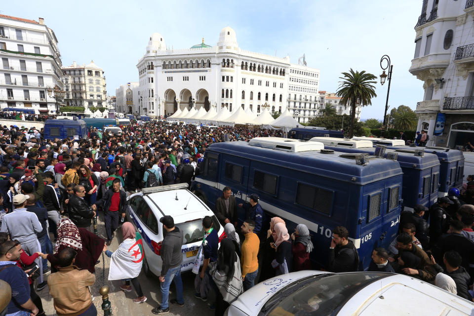 Algerian police forces block hundreds of students gathering in central Algiers to protest Algerian President Abdelaziz Bouteflika's decision to seek fifth term, Tuesday, March 6, 2019. Algerian students are gathering for new protests and are calling for a general strike if he doesn't meet their demands this week. (AP Photo/Toufik Doudou)