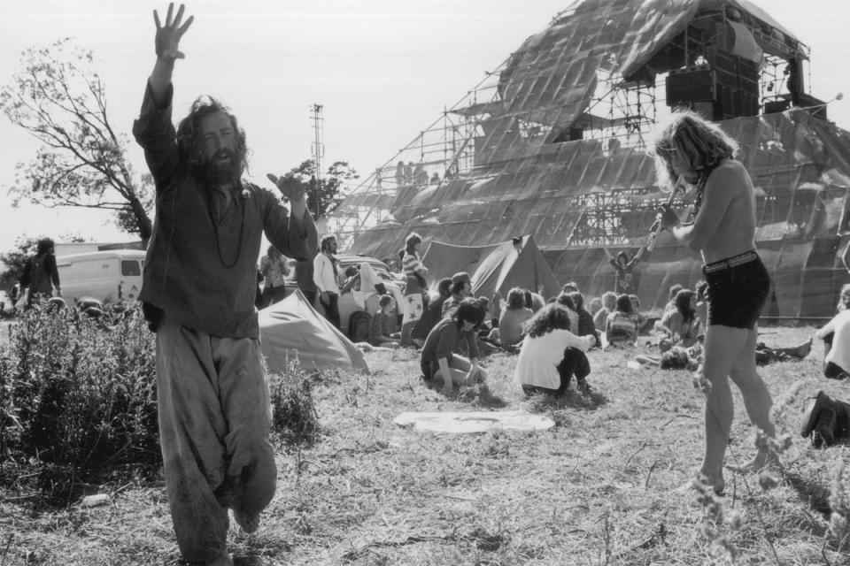 June 1971:  Hippies at the second Glastonbury Festival celebrate the summer solstice with music and dancing (Getty Images)