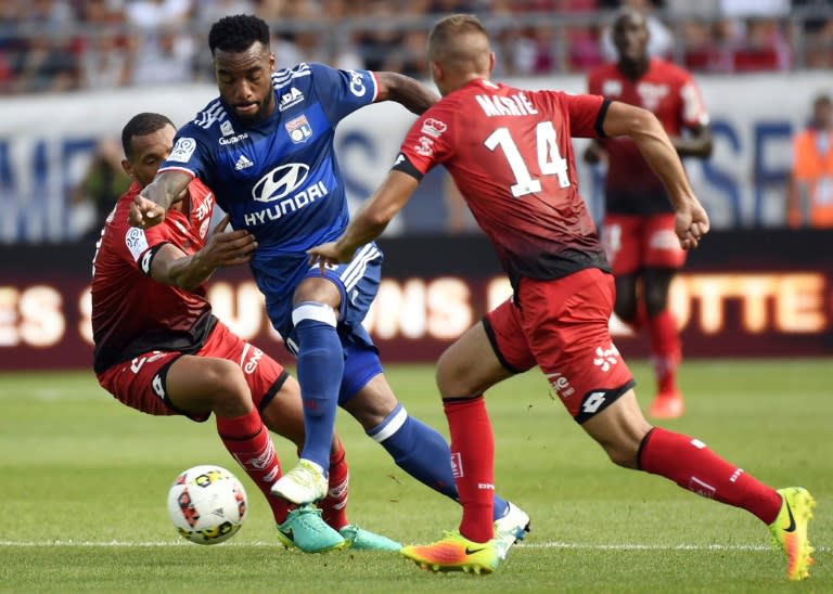 Lyon's French forward Alexandre Lacazette (C), pictured on August 27, 2016, put his team up on 37 minutes at the Stade Gaston-Gerard with his sixth goal this season, but hobbled off just before the break and was later seen with an ice pack