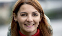 Ana-Maria Trasnea emigrated from Romania and candidate of the German Social Democrats, SPD, for the federal elections smiles during an interview with the Associated Press in her election district in Berlin, Germany, Saturday, Sept. 18, 2021. Hundreds of immigrants are running in Germany's national election on Sunday, raising the possibility of making its next parliament more diverse than ever. While it still might not fully represent the country's overall diversity, where more than a quarter of the population has immigrant roots, it's a step toward a more accurate reflection of society. (AP Photo/Michael Sohn)