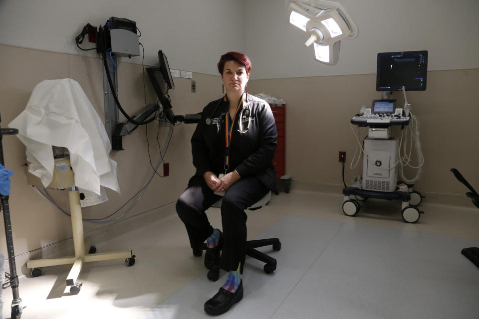 Dr. Colleen McNicholas, chief medical officer at Planned Parenthood of the St. Louis Region and Southwest Missouri, sits in a surgical room on Monday, April 11, 2022, at the Planned Parenthood clinic in Fairview Heights, Ill. The clinic is among those in Illinois that is seeing more requests for abortion services from women from states where abortions are being restricted. "Illinois is surrounded by lots of red. Illinois will be the haven site for most of the South come a devastating June decision," McNicholas said of the expectation that the U.S. Supreme Court will vote on a Mississippi abortion ban this summer. (AP Photo/Martha Irvine)