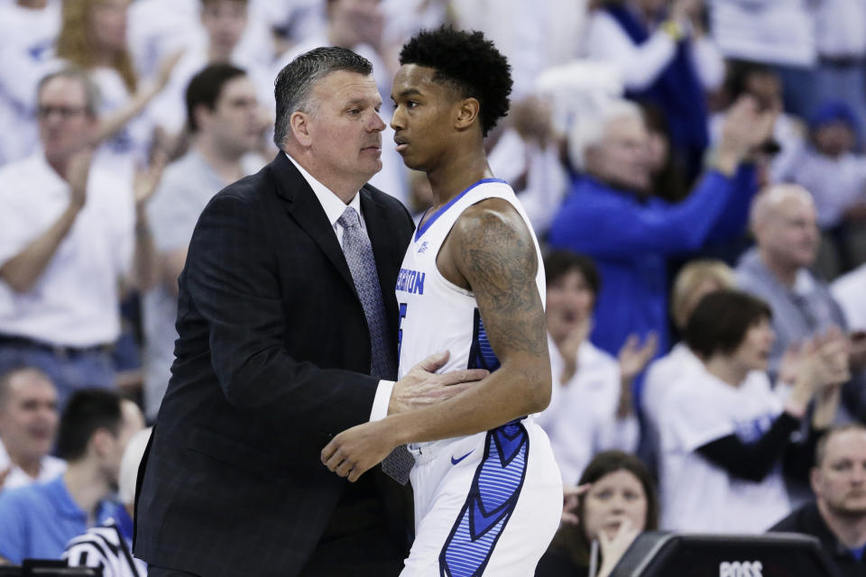 Creighton coach Greg McDermott talks to Ty-Shon Alexander (5) during the first half of an NCAA college basketball game against Seton Hall in Omaha, Neb., Saturday, March 7, 2020. (AP Photo/Nati Harnik)