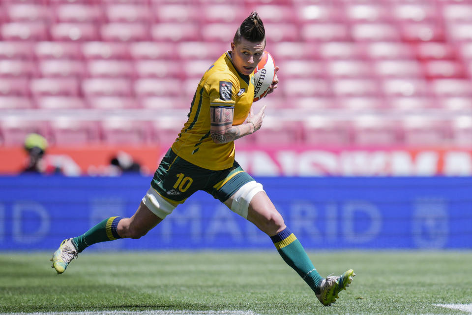 FILE - Raquel Kochhann of Brazil competes during the women's HSBC Rugby Sevens match between Brazil and Belgium in Madrid, Spain, Friday, May 31, 2024. A breast cancer diagnosis, surgery and months of follow-up treatment didn't shake Kochhann's desire to return to rugby sevens and have a shot at a third Olympics. (AP Photo/Bernat Armangue,File)