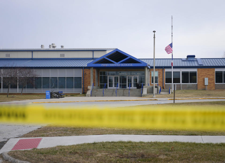 Tape blocks all entrances at the Perry Middle School and High School building on Friday, Jan. 5, 2024, in Perry, Iowa. A day after a shooting sent bullets flying inside the small-town Iowa high school, leaving a sixth grader dead and others wounded, the community of Perry is somber. (AP Photo/Bryon Houlgrave)