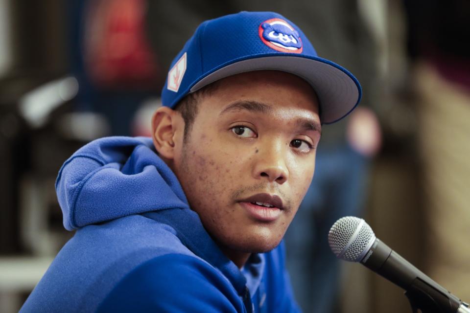 Chicago Cubs shortstop Addison Russell speaks at a press conference after a spring training baseball workout Friday, Feb. 15, 2019, in Mesa, Ariz. (AP Photo/Morry Gash)