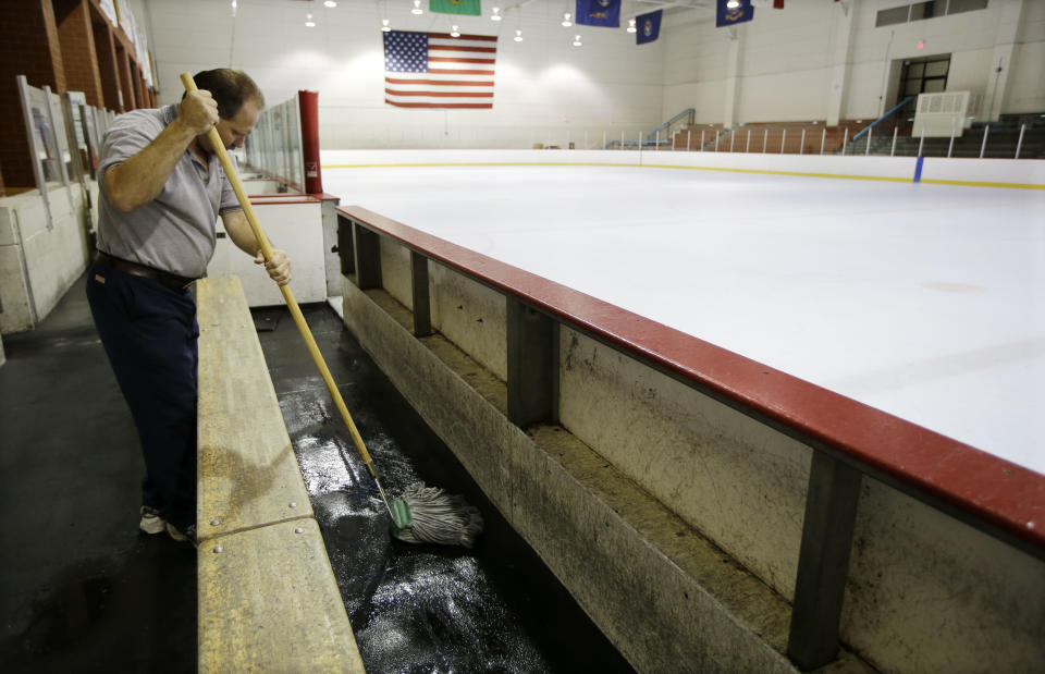 Tim Wilson cleans around a vacant Nashville Predators practice rink on Monday, Sept. 17, 2012, in Nashville, Tenn. The NHL locked out its players at midnight Saturday, the fourth shutdown for the NHL since 1992. (AP Photo/Mark Humphrey)