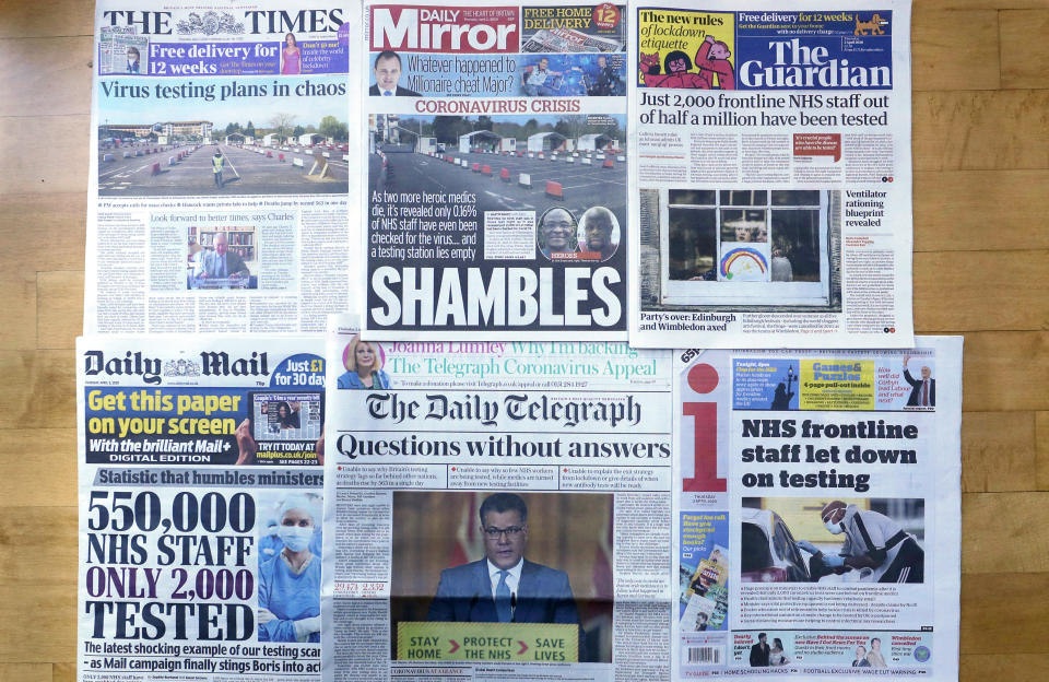 A view of the front pages of Britain's newspapers showing their coverage of the coronavirus, in London, Thursday, April 2, 2020. Newspapers in Britain have criticised the lack of testing NHS staff for the virus. The new coronavirus causes mild or moderate symptoms for most people, but for some, especially older adults and people with existing health problems, it can cause more severe illness or death. (AP Photo/Kirsty Wigglesworth)