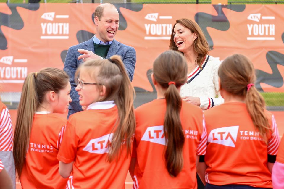 EDINBURGH, SCOTLAND - MAY 27: Prince William, Duke of Cambridge and Catherine, Duchess of Cambridge laugh as they speak to school children taking part in the Lawn Tennis Association's (LTA) Youth programme, at Craiglockhart Tennis Centre on May 26, 2021 in Edinburgh, Scotland. (Photo by Andy Buchanan - WPA Pool/Getty Images)