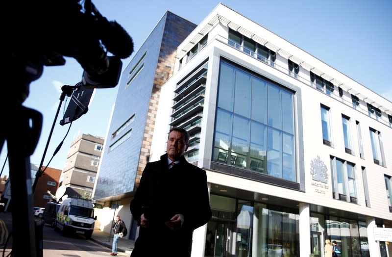 A TV reporter stands outside Chelmsford Magistrates' Court