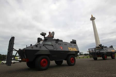 Police anti-riot vehicles arrive at the national monument, or Monas, ahead of Friday's planned protest against Jakarta's governor in Jakarta, Indonesia, December 1, 2016. REUTERS/Iqro Rinaldi