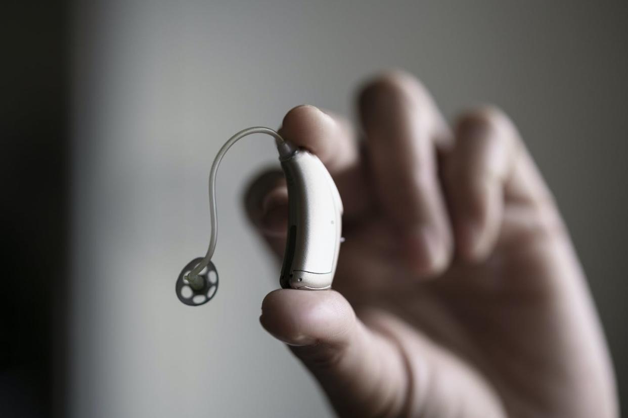 <span class="caption">The FDA Reauthorization Act of 2017 designated a new class of OTC hearing aids.</span> <span class="attribution"><a class="link " href="https://www.gettyimages.com/detail/photo/hand-holding-hearing-aid-royalty-free-image/1271529622" rel="nofollow noopener" target="_blank" data-ylk="slk:Johner Images/Getty Images;elm:context_link;itc:0;sec:content-canvas">Johner Images/Getty Images</a></span>
