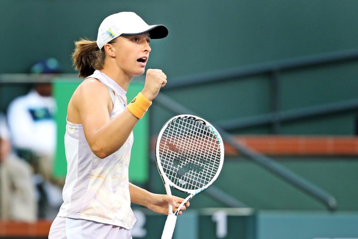 Iga Swiatek reacts during her win against Bianca Andreescu during the BNP Paribas Open in Indian Wells, Calif., on Monday, March 13, 2023. 