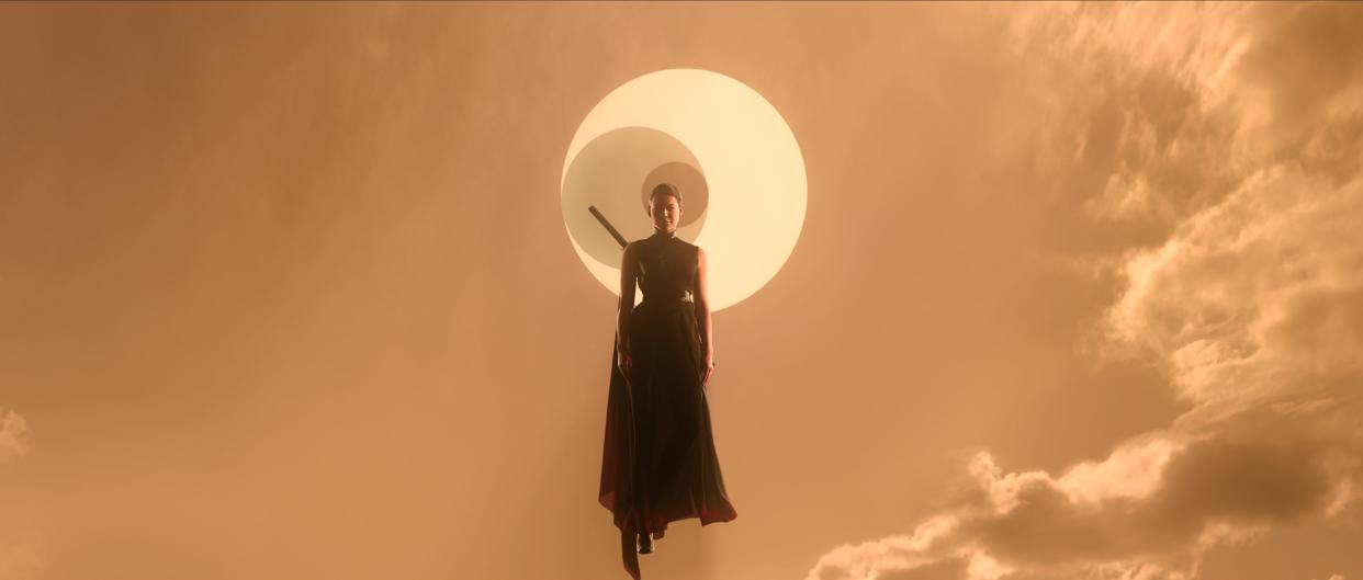 sea shimooka as sophon in three body problem, a woman in black robes and with a sword strapped to her back levitating in front of a logo of three concentric circles, shrouded in clouds