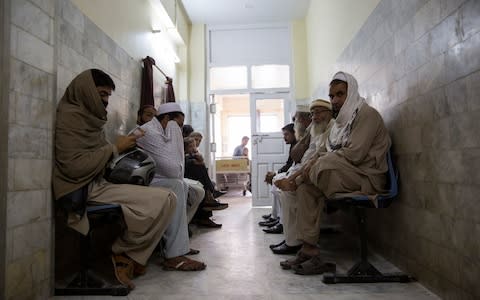 Patients wait outside the Cutaneous Leishmaniasis Treatment Centre at Naseerullah Babar Memorial Hospital on Nov 26, 2018 in Peshawar, Pakistan.  - Credit: Saiyna Bashir /The Telegraph