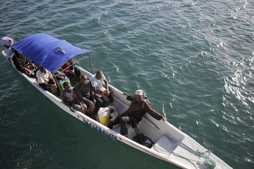 Fishermen head out to sea for their daily catch on Friday, June 10, 2022, at Shimoni port in Kwale county, Kenya. Artisanal fisheries on Kenya's coast say climate change, overfishing by large foreign vessels and a lack of other job opportunities for coastal communities is draining the Indian Ocean of its yellowfin tuna stocks. (AP Photo/Brian Inganga)