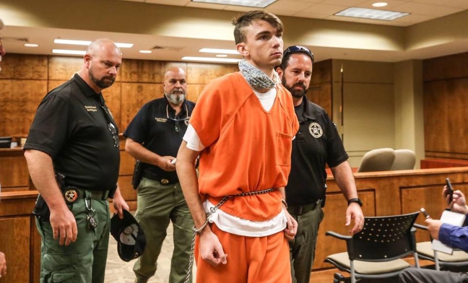 Austin Brookshire is lead out of at the Pearl River County Justice courtroom after his first court appearance Tuesday, July 21, 2020. He’s charged with first-degree murder in the killing of Picayune man Willie “Chill” Jones.