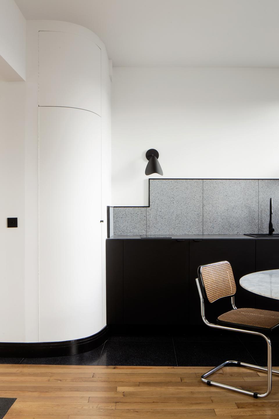 “In a small space, storage is the most important thing,” says Rebecca, who incorporated blink-and-you’ll-miss-them closets throughout the apartment. The original kitchen floor was stripped to its concrete base then retiled in black terrazzo.