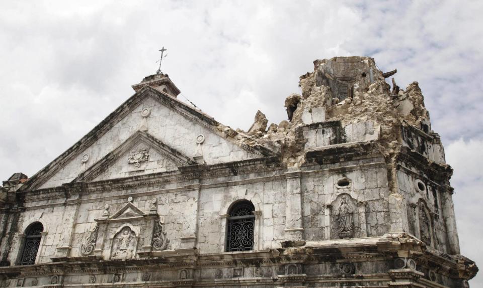 REFILE - CLARIFYING NAME OF BASILICA A general view of the damage on the historic Basilica Minore of Santo Nino de Cebu after an earthquake hit the church in Cebu City, central Philippines October 15, 2013. At least six people were killed when buildings collapsed on islands popular with tourists in the central Philippines on Tuesday, radio reports said, after an earthquake measuring 7.2 hit the region. REUTERS/Stringer (PHILIPPINES - Tags: DISASTER ENVIRONMENT RELIGION)