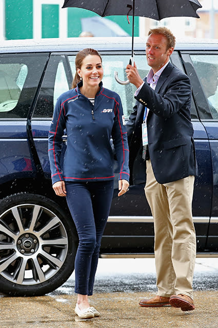 No surprise here. Even facing monsoon conditions and going casual, Kate Middleton looks pretty amazing. The 33-year-old Duchess of Cambridge attended the America's Cup World Series in Portsmouth, England on Sunday, her first official royal outing since giving birth to Princess Charlotte in May. Wearing matching navy blue Land Rover Bar team fleece jackets with her husband, 33-year-old Prince William, the royal couple was picture-perfect as ever rocking their custom gear. Thank you for the warm welcome from everyone at the #ACWSPortsmouth @EmiratesTeamNZ base this morning pic.twitter.com/mPULkHFYz5— Kensington Palace (@KensingtonRoyal) July 26, 2015 <strong>PHOTOS: Prince William and Kate Middleton's Adorable Family Photo Album</strong> With her hair pulled back in a ponytail, Kate looked fresh-faced, rocking skinny jeans and flats. Getty Images Sadly, the America's Cup races had to be canceled because of bad weather, though Kate and William still met a few of the families of the crew and management teams. Congratulations to all the @americascup teams and thanks for a great day (in spite of the rain!) at #ACWSPortsmouth pic.twitter.com/uAsHahCAPm— Kensington Palace (@KensingtonRoyal) July 26, 2015 Kate also paid an important visit to the 1851 Trust, of which she's a patron of. The 1851 Trust aims to inspire and engage a new generation through sailing and the marine industry, and is supported by the Land Rover Bar team. The Duchess of Cambridge views logos designed by children for the @1851Trust #ACWSPortsmouth pic.twitter.com/IdpFqKOlOu— Kensington Palace (@KensingtonRoyal) July 26, 2015 While visiting Land Rover Ben Ainslie Racing's headquarters, Kate also dished about her scene-stealing son, 2-year-old Prince George. It turns out the adorable royal thinks he's actually older than he is! When Kate met 2-year-old Freddie Wilson, his mother -- Wendy Maxwell -- told reporters that Freddie mistakenly said he was 3-years-old, to which Kate replied, 'George says that. He thinks that he's older.'" Too cute! <strong>PHOTOS: Prince George's Most Adorable Moments</strong> But George is, of course, no longer the only adorably royal baby -- check out Princess Charlotte's beautiful christening photos shot by famed photographer Mario Testino in the video below.