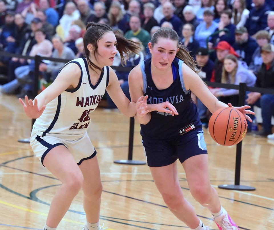 Moravia's Allison Kehoe is defended by Watkins Glen's Rachel Vickio during the Blue Devils' 50-42 win in the Section 4 Class C girls basketball final March 2, 2024 at Tompkins Cortland Community College in Dryden.