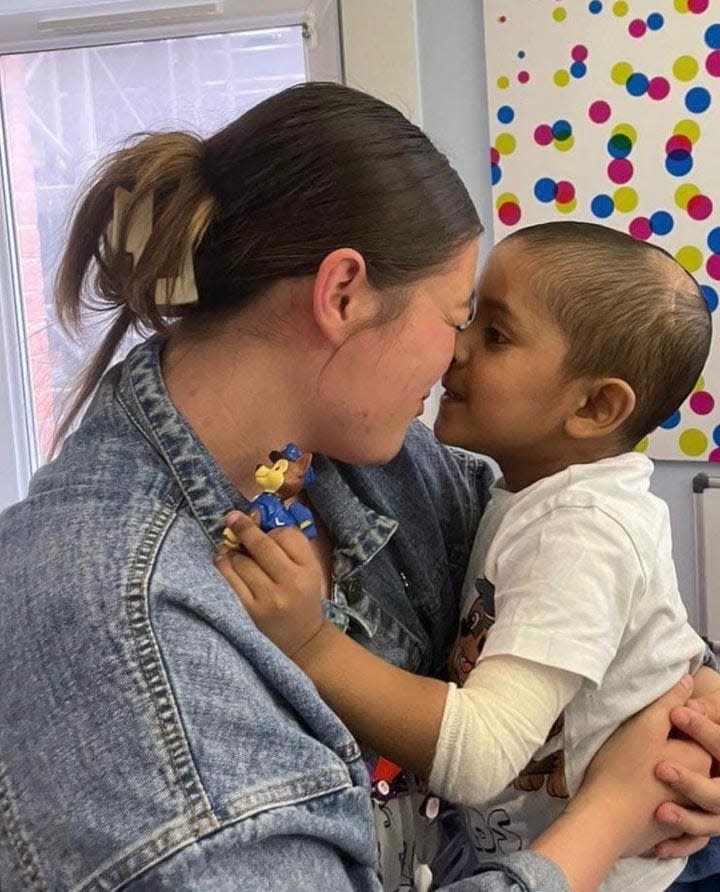 Molly Oldham of Bath Township and young patient Essa of London, both of whom have anaplastic ependymoma, meet at a London hospital.