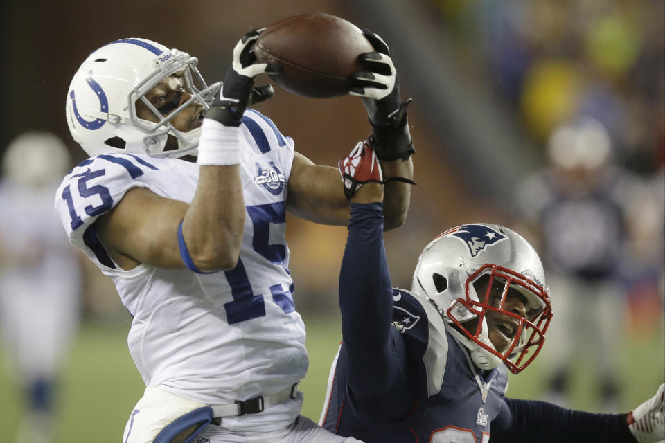 Indianapolis Colts wide receiver LaVon Brazill (15) pulls in a touchdown pass over New England Patriots cornerback Alfonzo Dennard, right, during the first half of an AFC divisional NFL playoff football game in Foxborough, Mass., Saturday, Jan. 11, 2014. (AP Photo/Stephan Savoia)