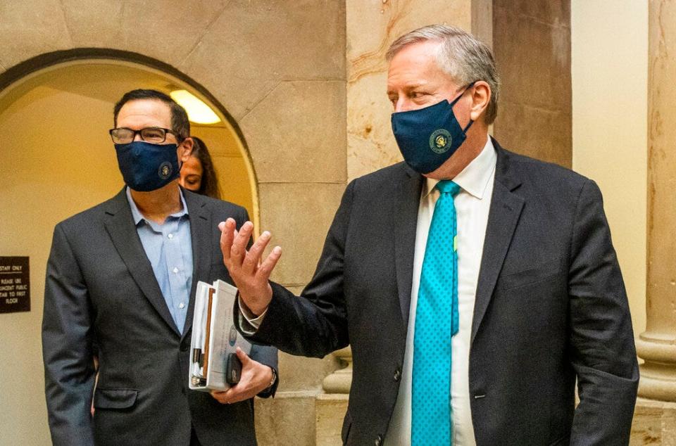 White House chief of staff Mark Meadows, right, and Treasury Secretary Steven Mnuchin arrive at the office of House Speaker Nancy Pelosi at the Capitol to resume talks on a COVID-19 relief bill Aug. 1 in Washington.