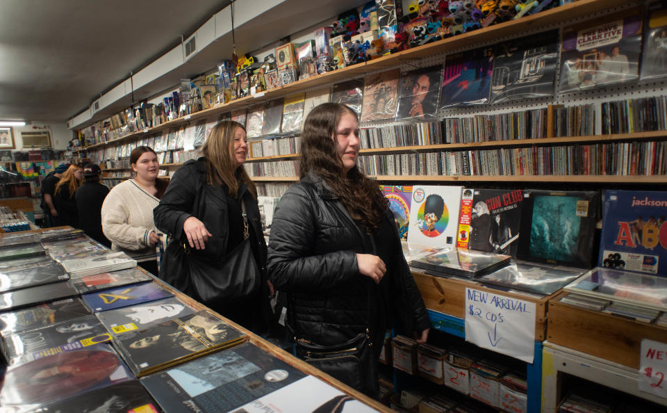 From left, Abby Devincent, of Levittown, Gina Cuddy and her daughter, Rachel Cuddy , of Jenkintown, arrive to purchase a Taylor Swift album during Record Store Day, when Positively Records opened from midnight to 2 a.m. Saturday, April 23, 2022 in Levittown for  Record Store Day from artists.