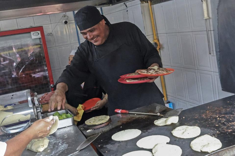 The heat is one of the few secrets Rivera Martínez would share. The steel grill has to be heated to an astounding 680 degrees. AFP via Getty Images