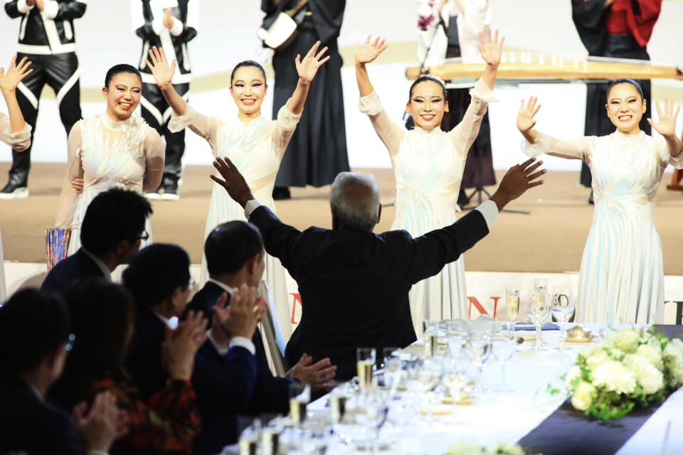 East Timor Prime Minister Xanana Gusmao, center, reacts to Japanese high school dancers at the gala dinner for the 50th anniversary event between ASEAN and Japan in Tokyo, Sunday Dec. 17, 2023. ASEAN and Japan celebrate its 50th anniversary of their friendship and cooperation in Tokyo through Dec. 18. (Yoshikazu Tsuno/Pool Photo via AP)