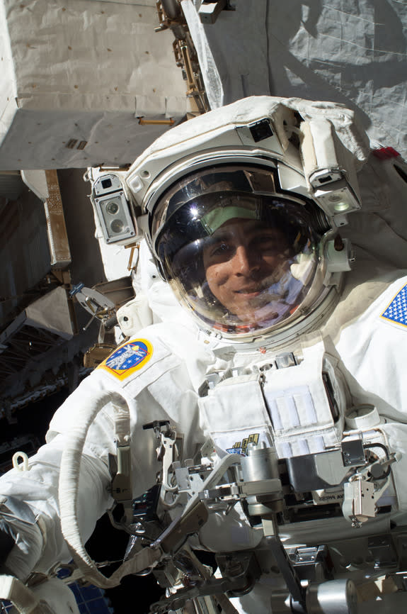 Chris Cassidy works on the International Space Station. A little more than one hour into the spacewalk, Luca Parmitano (out of frame) reported water floating behind his head inside his helmet. This image was released July 16, 2013.