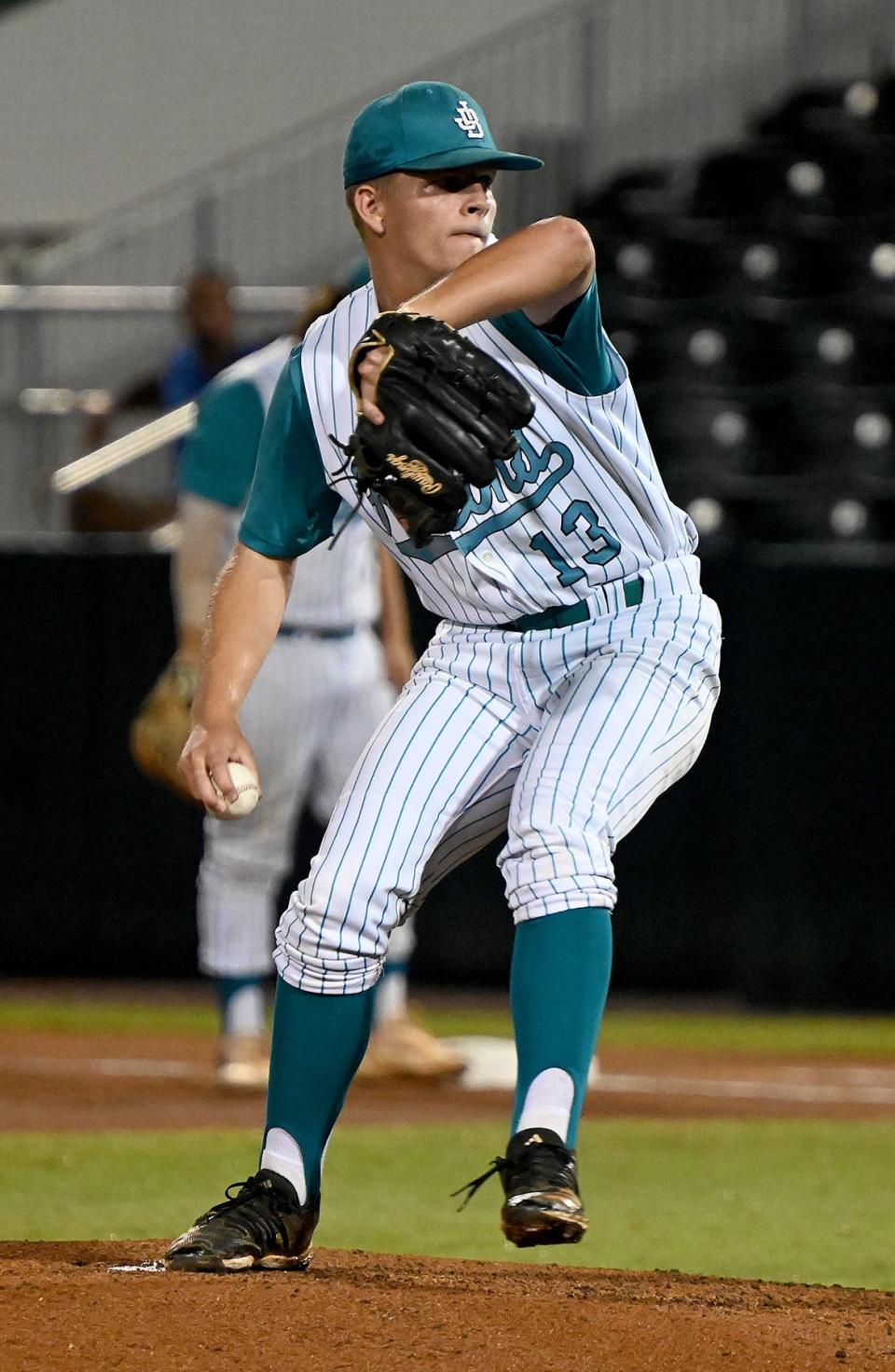 Jensen Beach High School's Chris Knier fires a pitch to the plate against Dunedin during a 4A state semifinal in Fort Myers, Monday, May 23, 2022. (Photo/Chris Tilley)