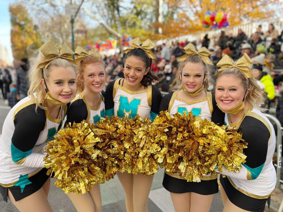 Hallie Dancer, left, Josie Castle, Gracie Cantrell, Paisley Taylor and Becca Madden pose for a photo together along the route at the Macy's Thanksgiving Day Parade. The girls were part of a group of 16 from Oklahoma taking part.